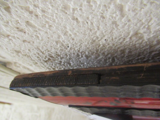 A RED TORTOISESHELL AND EBONY(?) WALL MIRROR of 17th century design, 19th century, the oblong plate Image