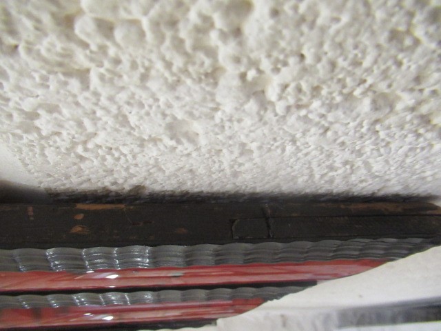 A RED TORTOISESHELL AND EBONY(?) WALL MIRROR of 17th century design, 19th century, the oblong plate Image