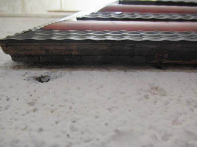 A RED TORTOISESHELL AND EBONY(?) WALL MIRROR of 17th century design, 19th century, the oblong plate Image