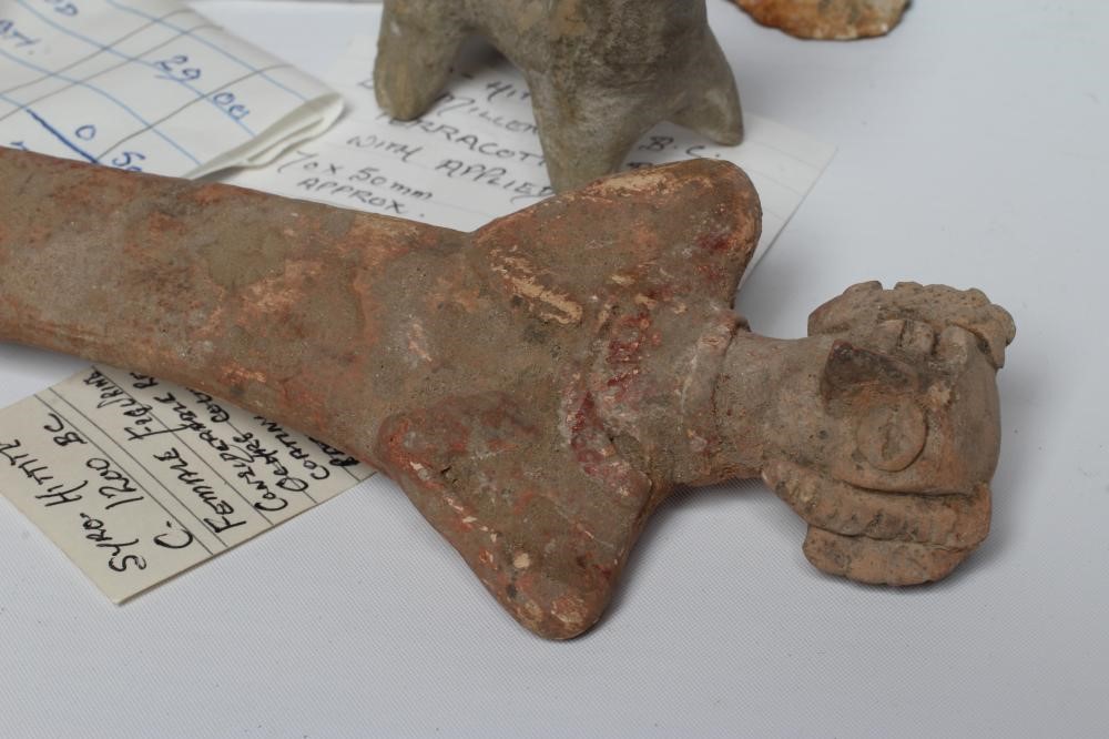 A COLLECTION OF NORTH AFRICAN AND SYRO-HITTITE ANTIQUITIES comprising of a terracotta bull with Image