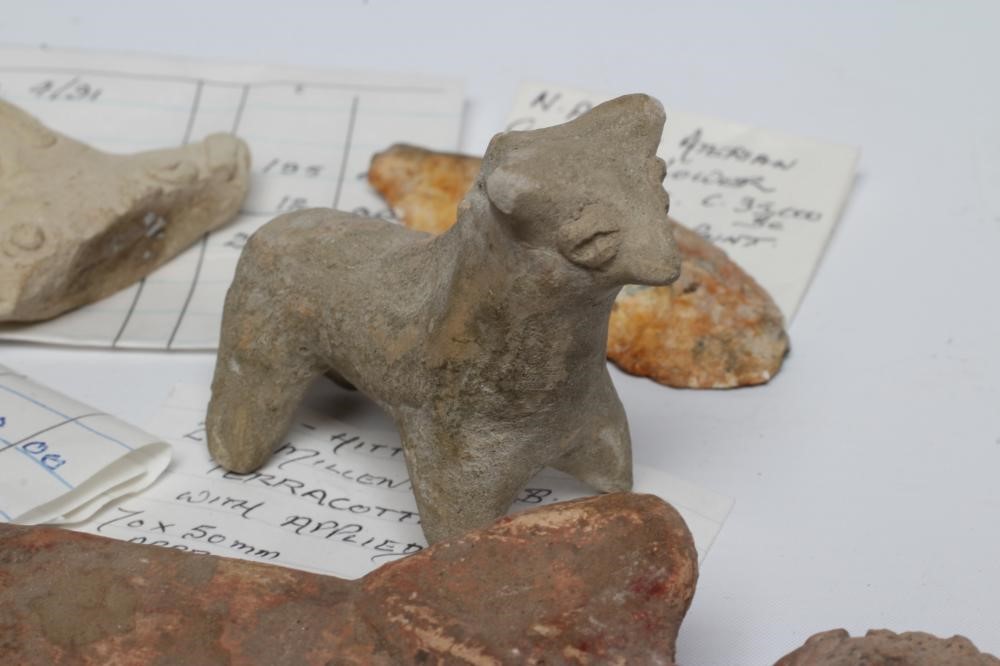 A COLLECTION OF NORTH AFRICAN AND SYRO-HITTITE ANTIQUITIES comprising of a terracotta bull with Image