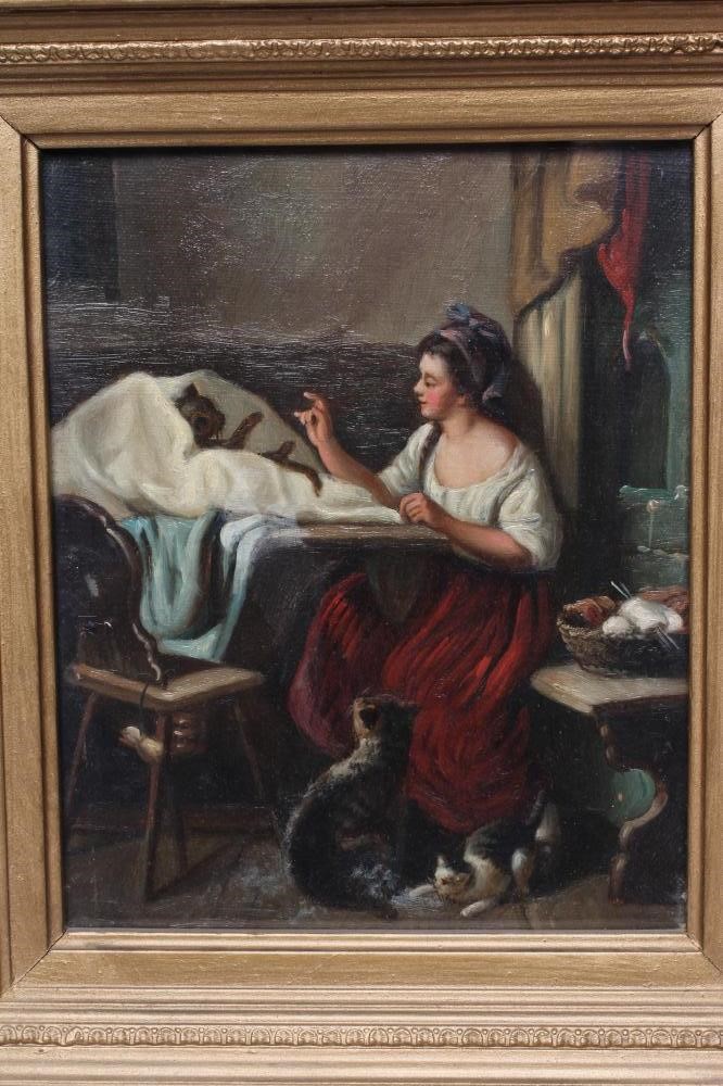 BRITISH SCHOOL (early 20th century) Cottage interiors with dogs and cats, a pair, oil on canvas, Image