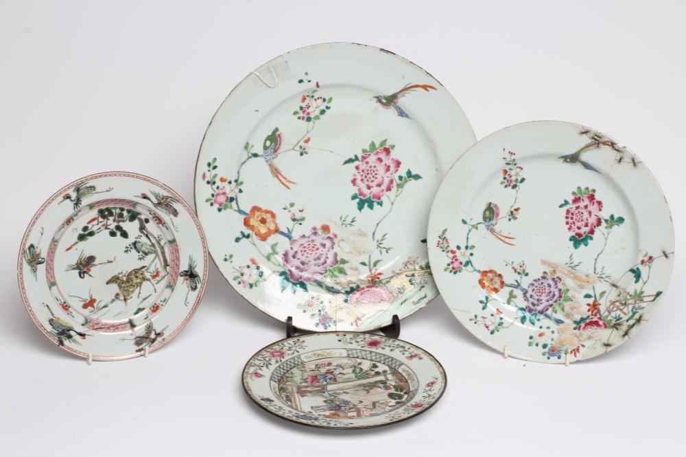 A GRADUATED PAIR OF CHINESE PORCELAIN CHARGERS of plain circular form painted in coloured enamels Image