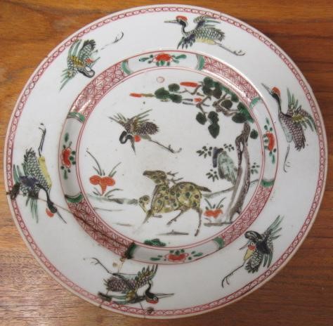 A GRADUATED PAIR OF CHINESE PORCELAIN CHARGERS of plain circular form painted in coloured enamels Image