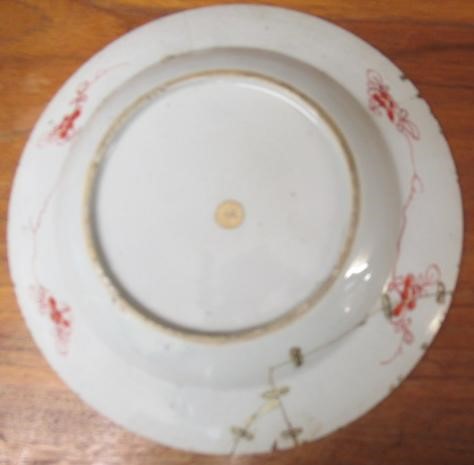 A GRADUATED PAIR OF CHINESE PORCELAIN CHARGERS of plain circular form painted in coloured enamels Image