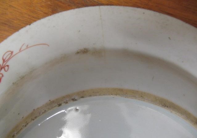 A GRADUATED PAIR OF CHINESE PORCELAIN CHARGERS of plain circular form painted in coloured enamels Image