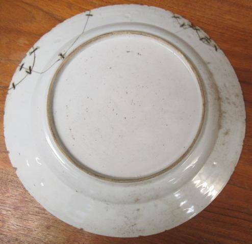 A GRADUATED PAIR OF CHINESE PORCELAIN CHARGERS of plain circular form painted in coloured enamels Image