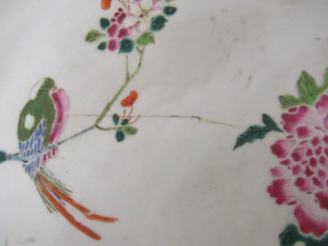 A GRADUATED PAIR OF CHINESE PORCELAIN CHARGERS of plain circular form painted in coloured enamels Image