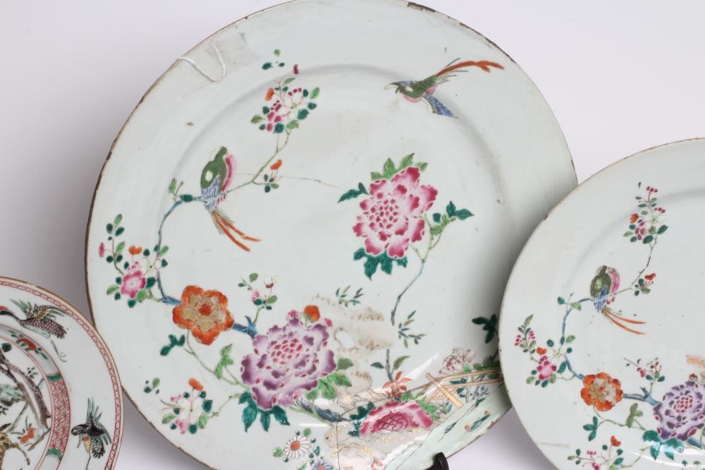 A GRADUATED PAIR OF CHINESE PORCELAIN CHARGERS of plain circular form painted in coloured enamels Image