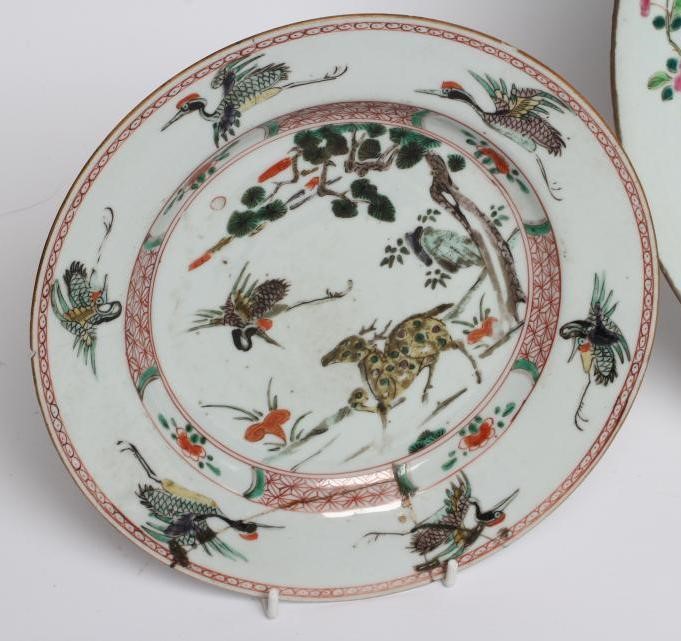 A GRADUATED PAIR OF CHINESE PORCELAIN CHARGERS of plain circular form painted in coloured enamels Image