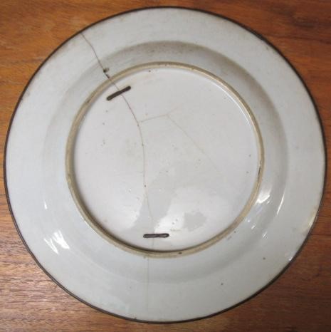 A GRADUATED PAIR OF CHINESE PORCELAIN CHARGERS of plain circular form painted in coloured enamels Image