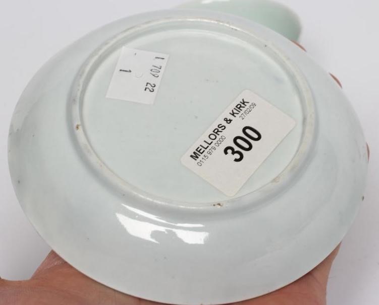 A CHAFFERS PORCELAIN TEA BOWL AND SAUCER Image