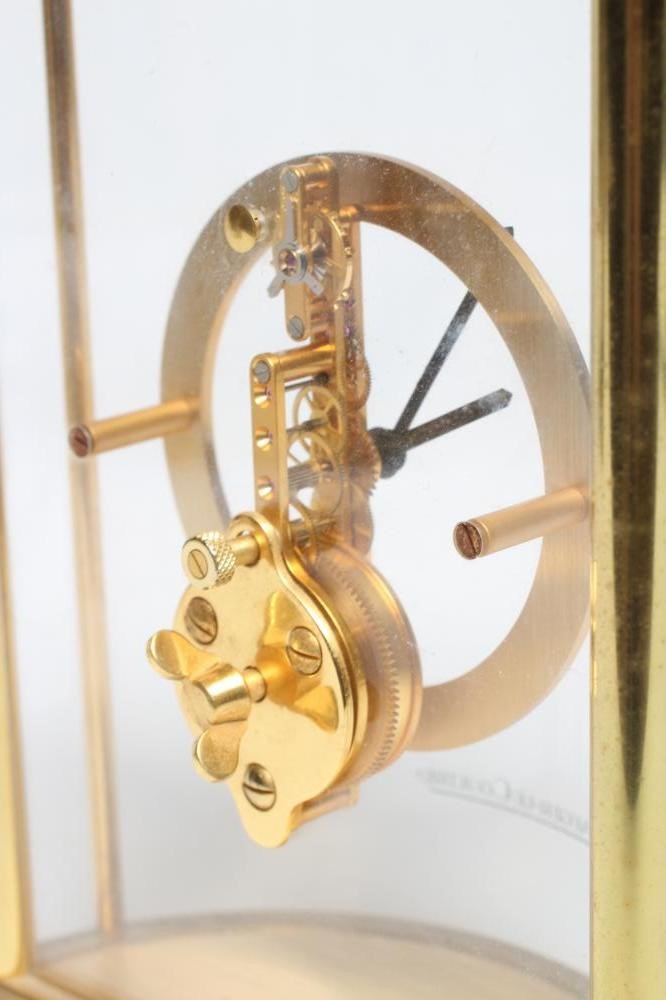 A JAEGER-LECOULTRE SKELETON MANTEL CLOCK with exposed gilt brass jewelled movement Image