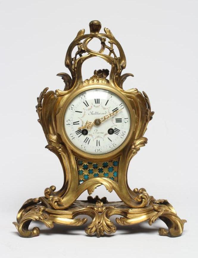 A FRENCH GILT CASED MANTEL CLOCK Image