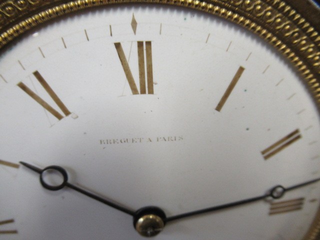 A FRENCH GILT AND PATINATED BRONZE MANTEL CLOCK BY BREGUET Image