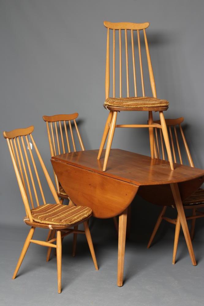 AN ERCOL WINDSOR MODEL 384 TABLE AND FOUR CHAIRS Image