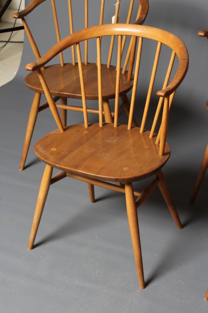 A SET OF FOUR ERCOL MODEL 449A CHAIRS, in blond beech and elm with cow horn arms, 21 3/4" x 14 3/4" Image