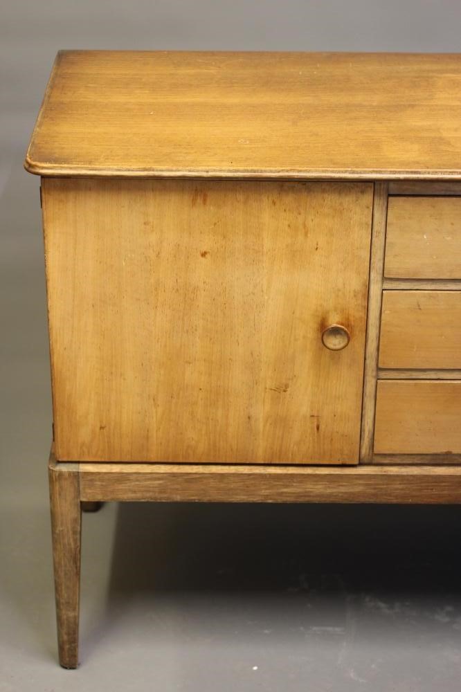 A GORDON RUSSELL WALNUT DINING SUITE Image