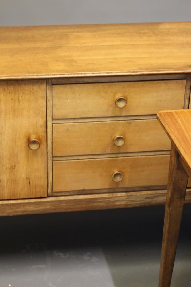 A GORDON RUSSELL WALNUT DINING SUITE Image