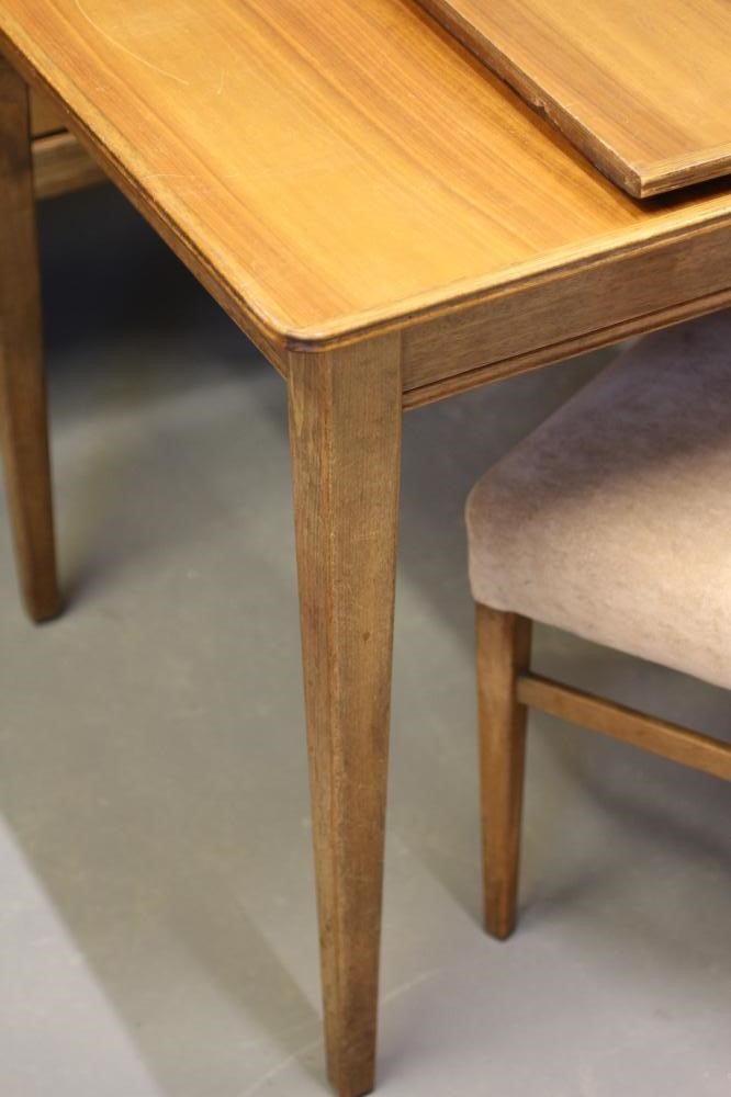 A GORDON RUSSELL WALNUT DINING SUITE Image