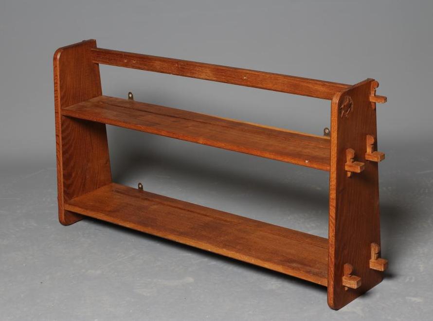 A BOB HUNTER (THIRLBY) OAK WALL PLATE RACK, comprising two shelves tenoned into tapering ends, Image
