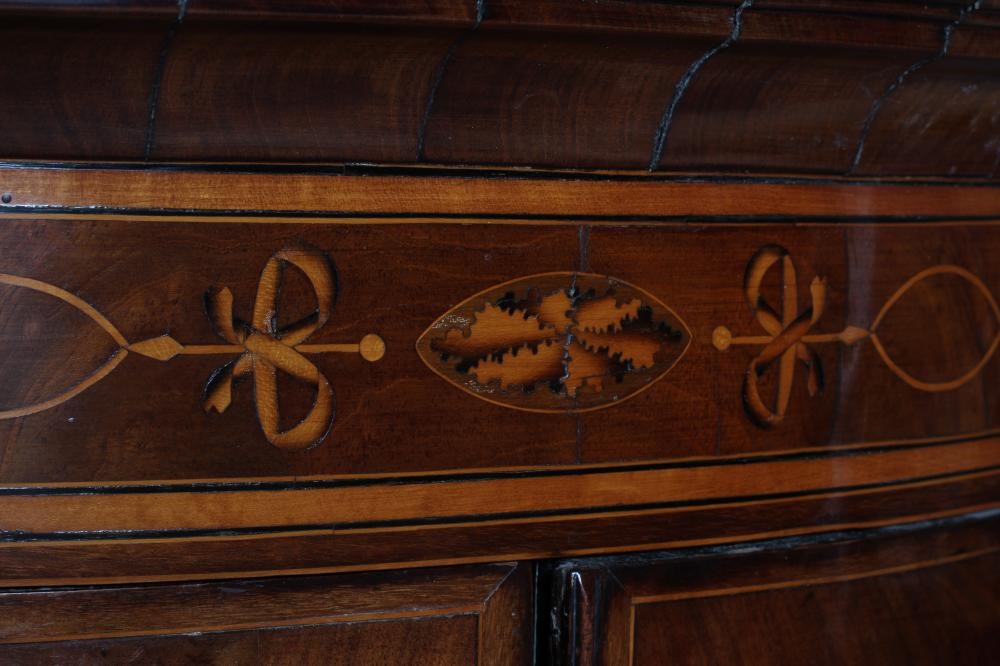 A GEORGE III MAHOGANY CORNER CUPBOARD Image