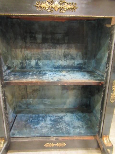 AN EGYPTIAN REVIVAL EBONISED PIER CABINET Image