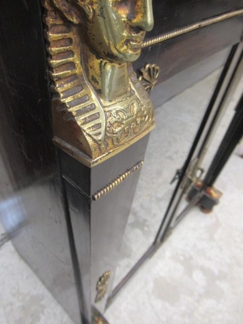 AN EGYPTIAN REVIVAL EBONISED PIER CABINET Image