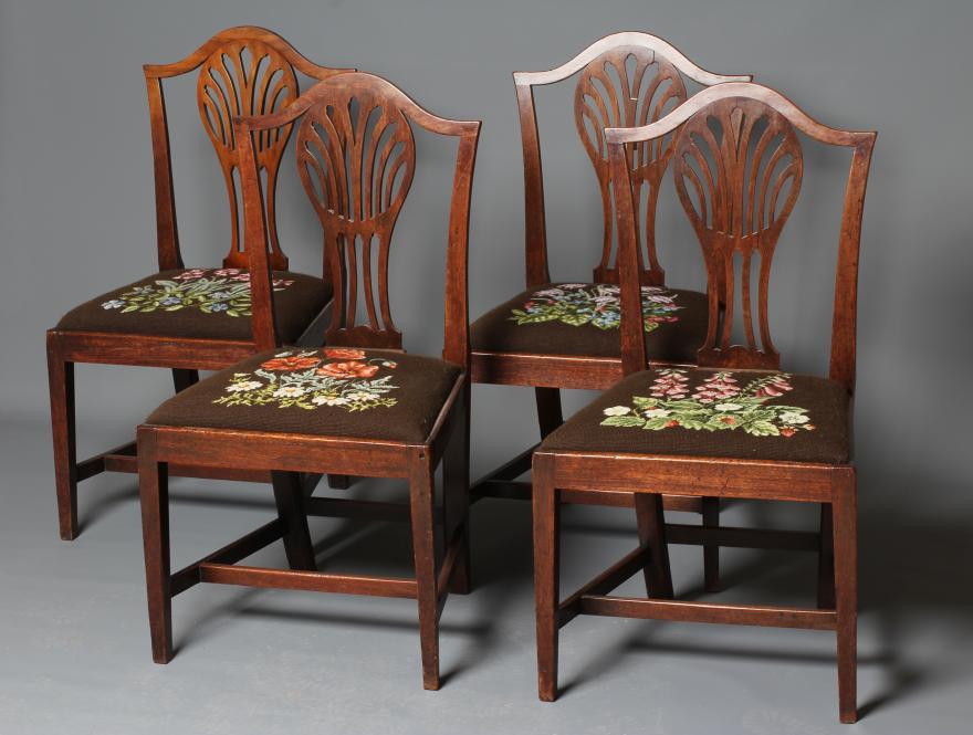 A SET OF FOUR GEORGIAN MAHOGANY DINING CHAIRS of Hepplewhite type Image