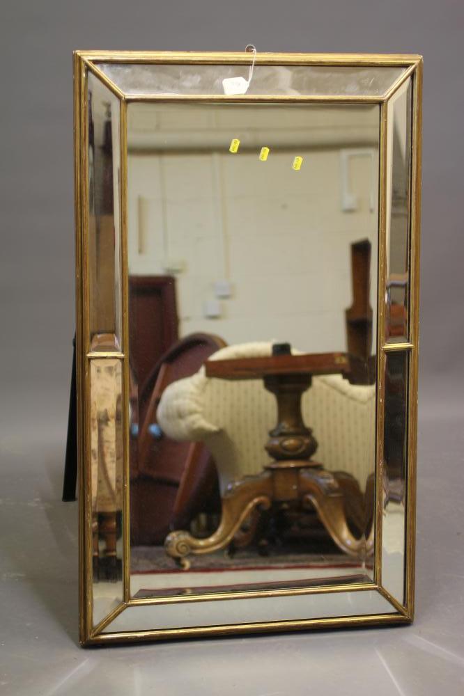A GILDED SECTIONAL PIER GLASS, late 19th century, of oblong bolection form with bevelled plates, Image
