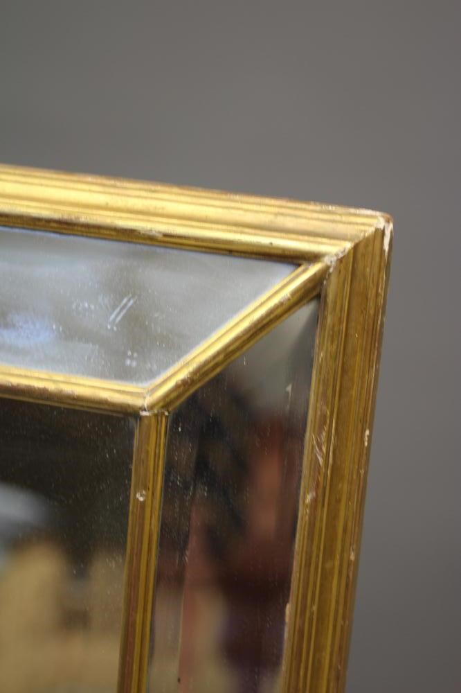 A GILDED SECTIONAL PIER GLASS, late 19th century, of oblong bolection form with bevelled plates, Image