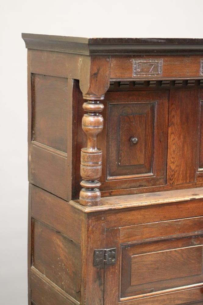 A JOINED OAK PRESS CUPBOARD Image