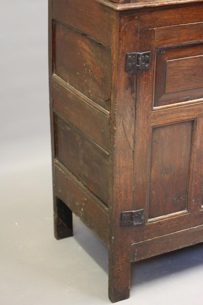 A JOINED OAK PRESS CUPBOARD Image