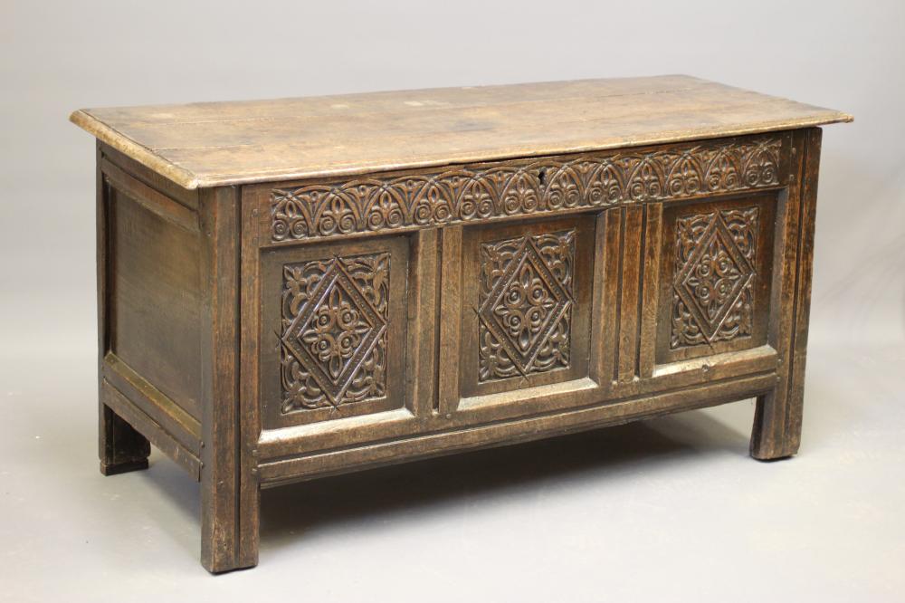 AN OAK PANELLED COFFER Image