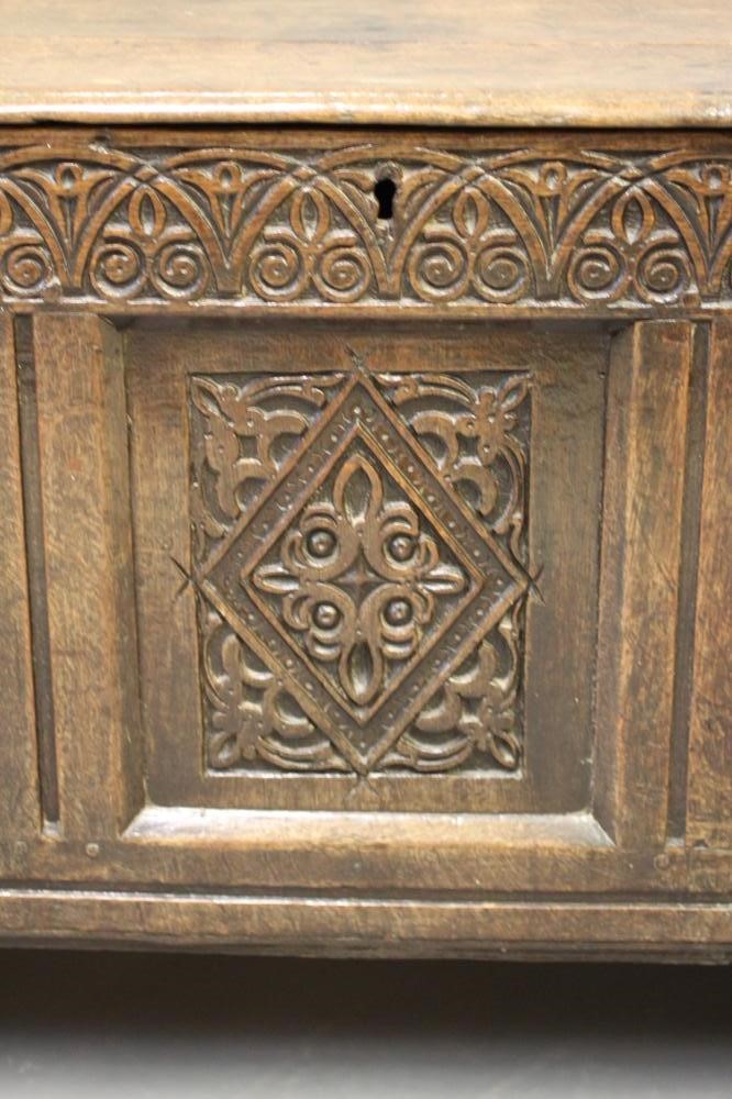 AN OAK PANELLED COFFER Image