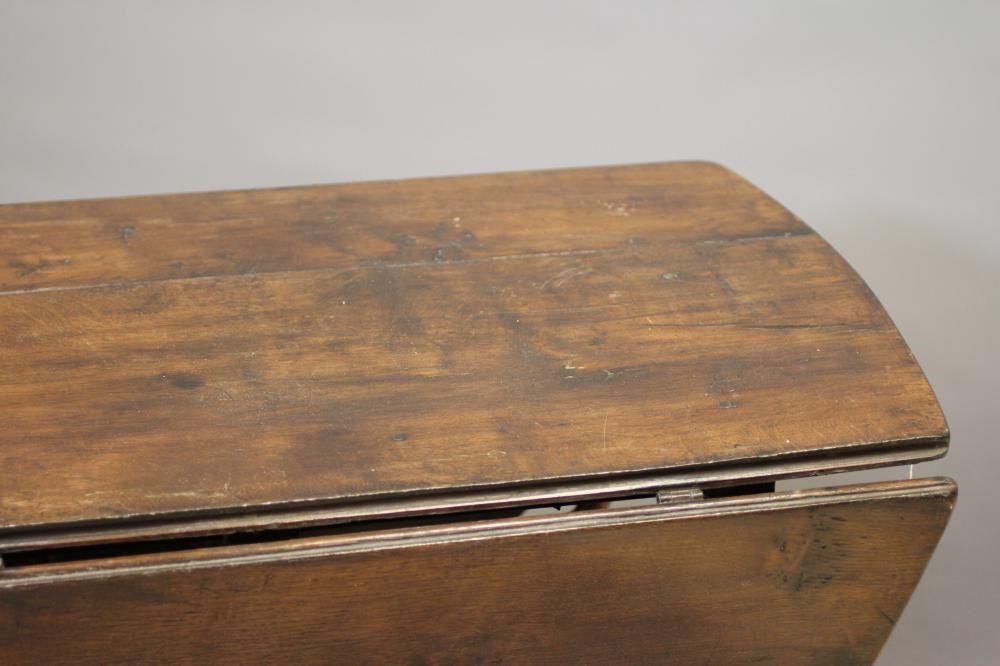 AN OAK GATELEG DINING TABLE Image