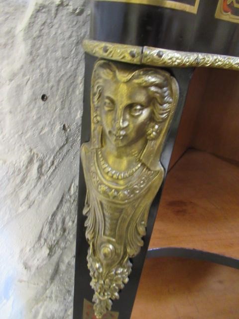 A RED BOULLE CORNER CABINET Image