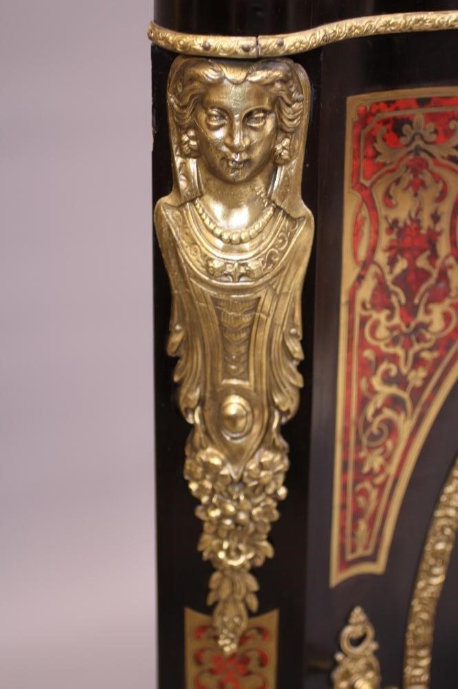 A RED BOULLE CORNER CABINET Image