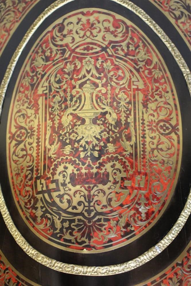 A RED BOULLE CORNER CABINET Image