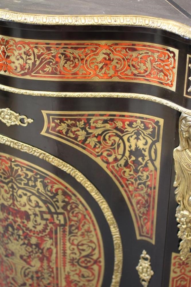 A RED BOULLE CORNER CABINET Image