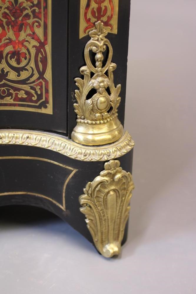 A RED BOULLE CORNER CABINET Image