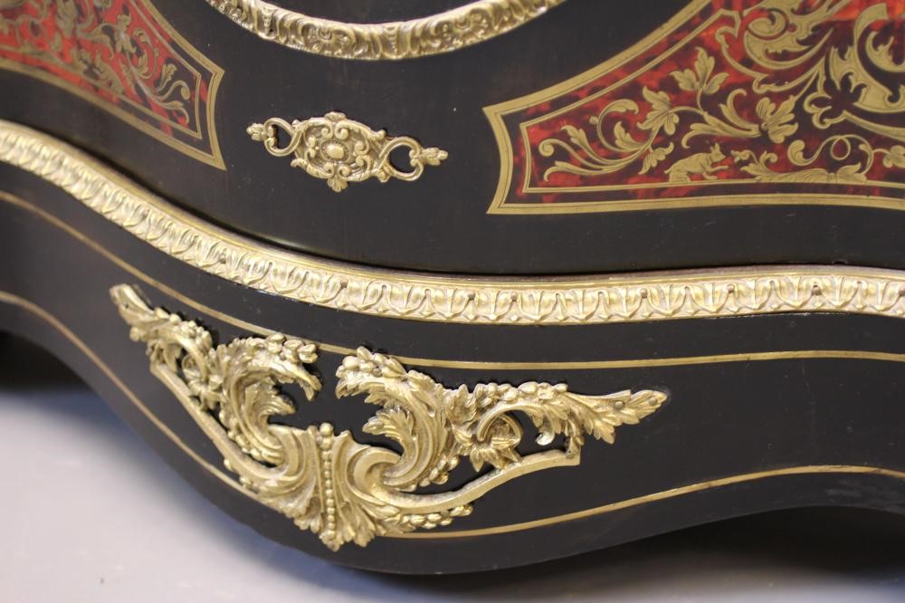 A RED BOULLE CORNER CABINET Image