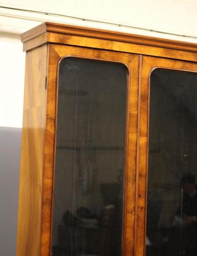 A VICTORIAN WALNUT TWO STAGE BOOKCASE Image