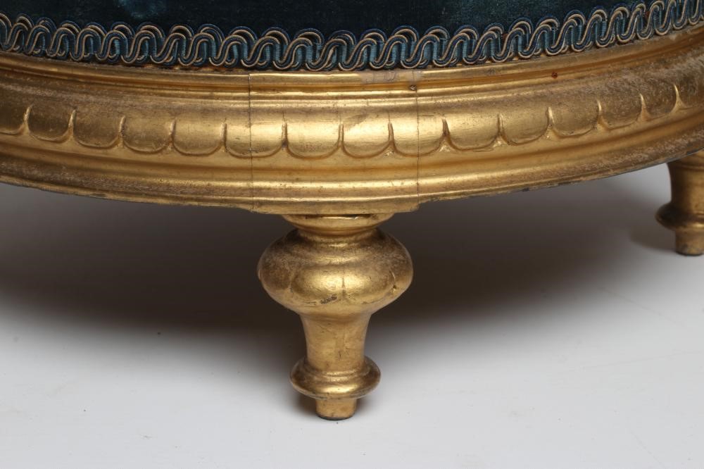 A PAIR OF EARLY VICTORIAN GILT WOOD FOOT STOOLS, of circular form upholstered in floral beadwork and Image