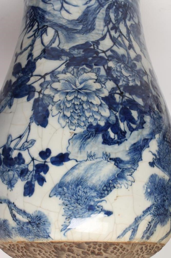 A PAIR OF CHINESE CRACKLE GLAZE VASES AND COVERS of inverted baluster form painted in underglaze Image