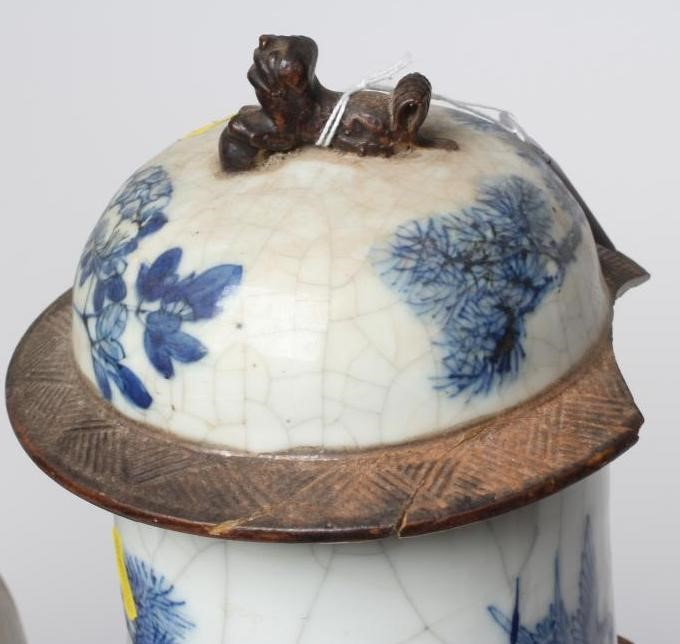 A PAIR OF CHINESE CRACKLE GLAZE VASES AND COVERS of inverted baluster form painted in underglaze Image