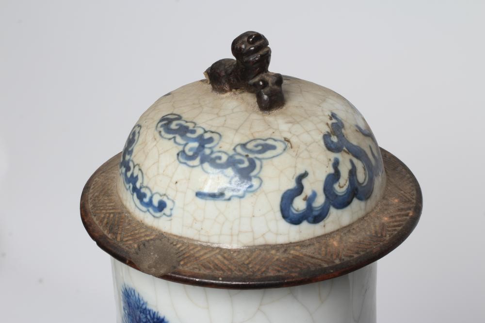 A PAIR OF CHINESE CRACKLE GLAZE VASES AND COVERS of inverted baluster form painted in underglaze Image