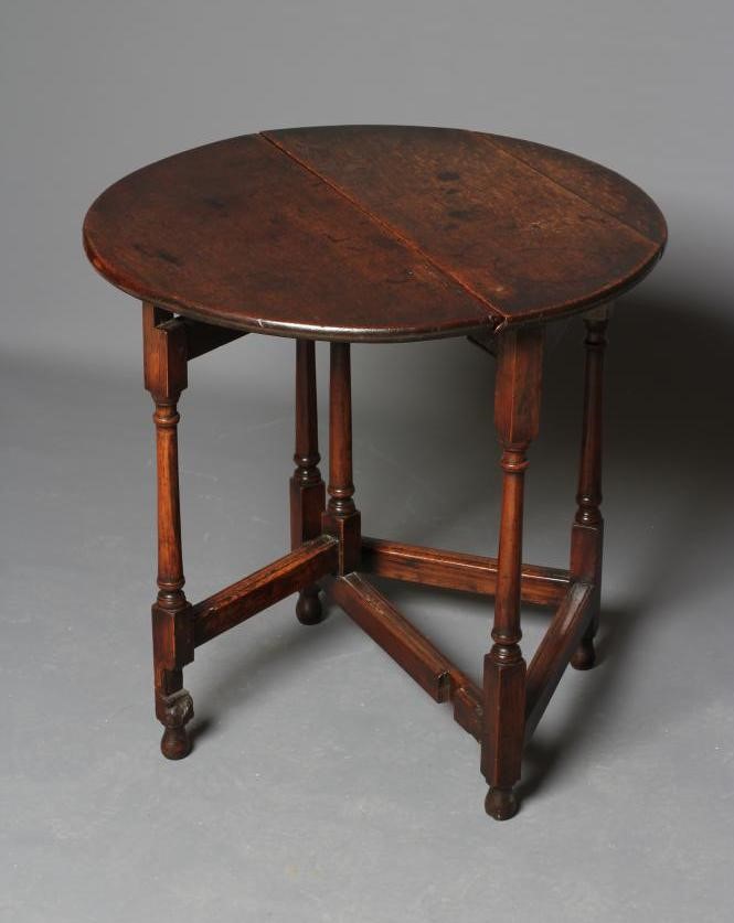 A SMALL JOINED OAK GATELEG TABLE Image