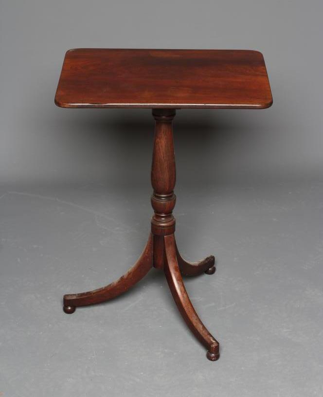A REGENCY MAHOGANY WINE TABLE, early 19th century, the rounded oblong top on turned vase stem, on Image