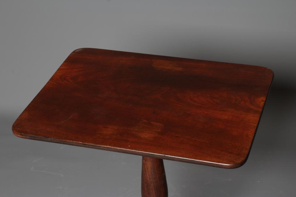 A REGENCY MAHOGANY WINE TABLE, early 19th century, the rounded oblong top on turned vase stem, on Image